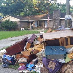 Home with interior debris on front curb