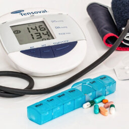 Blood pressure medication in front of a monitor