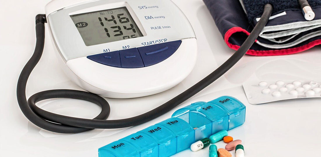 Blood pressure medication in front of a monitor