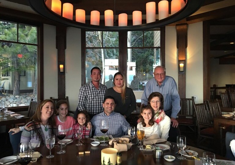 Family and agents sitting around a large table