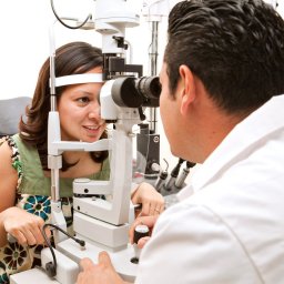 Optometrist giving an eye exam