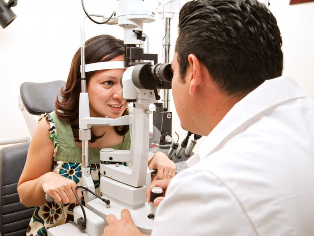 Optometrist giving an eye exam