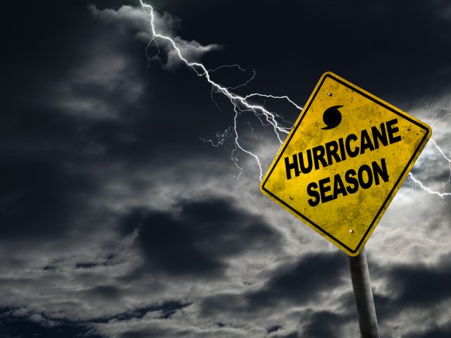 Yellow sign with storm behind