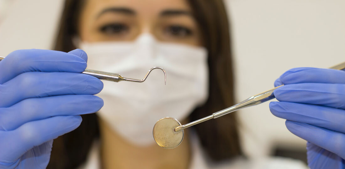 Dentist with tools