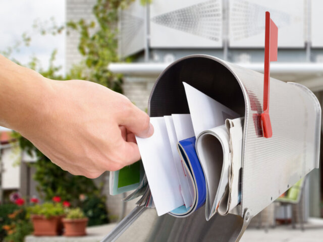 Hand in mailbox