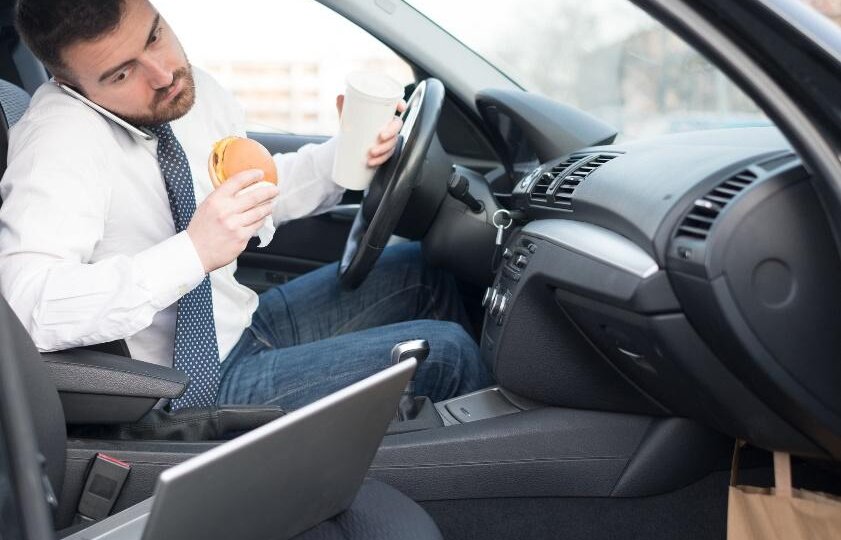 Man eating in car