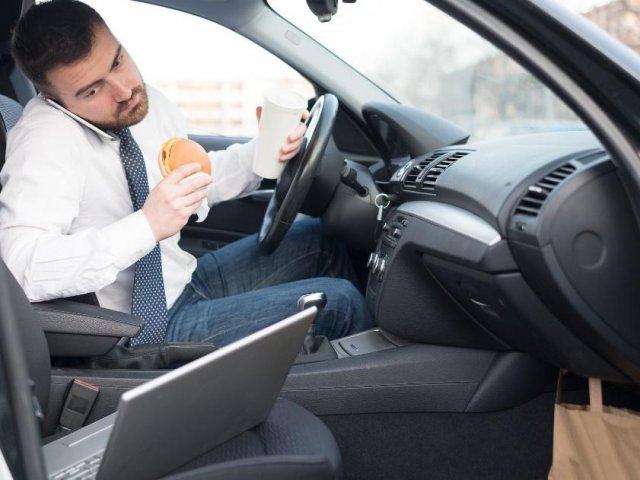 Man eating in car