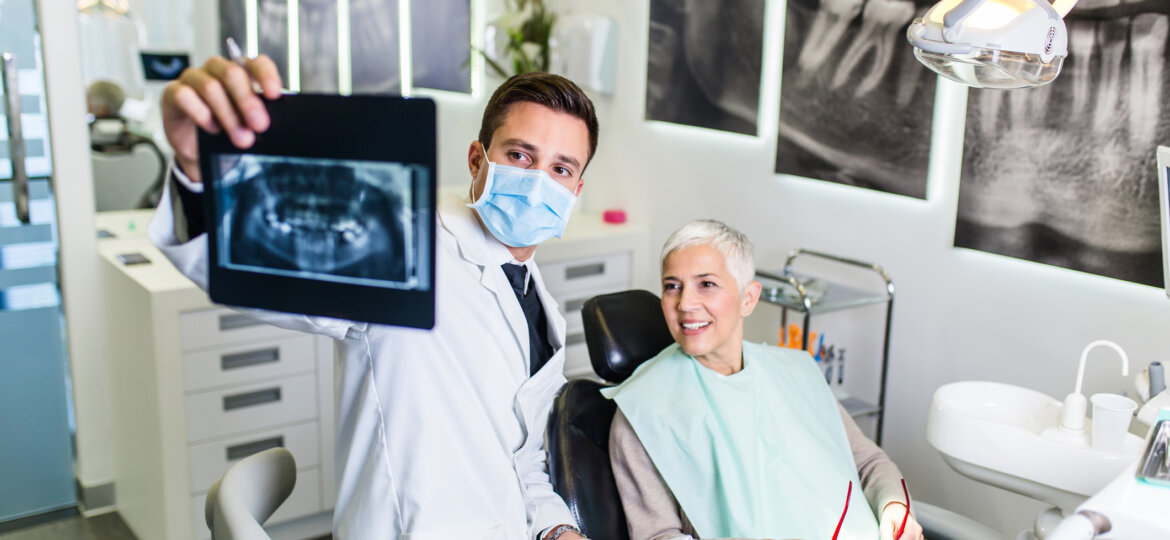 Woman sitting with dentist