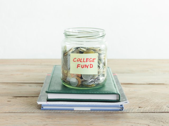 Money jar on books