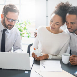 Couple at table with broker