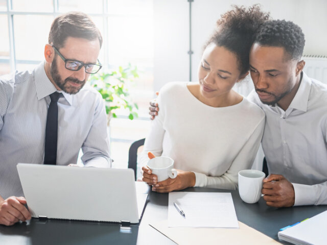 Couple at table with broker