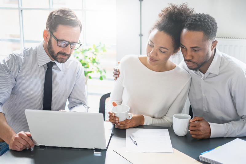 Couple at table with broker