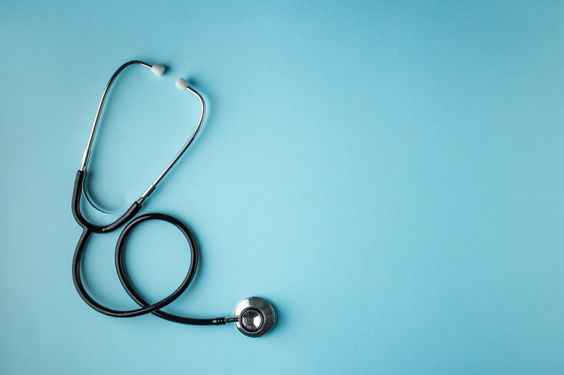 Stethoscope on blue background