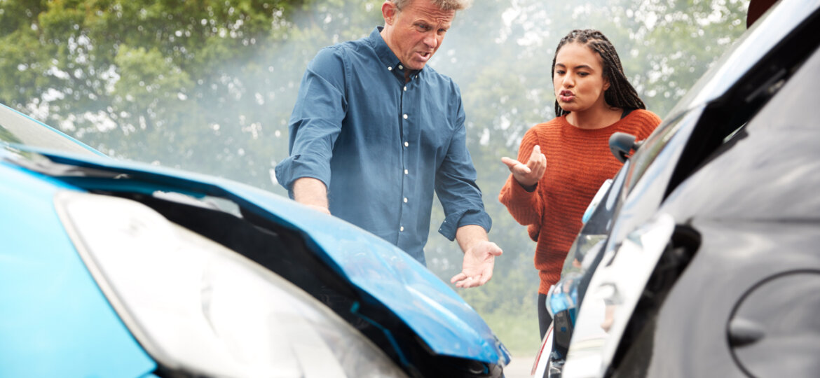 Two Angry Motorists Arguing Over Responsibility For Car Accident