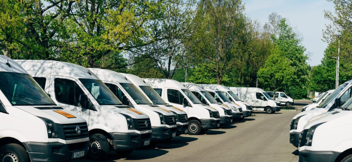 Line of white commercial vans