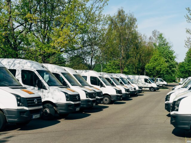 Line of white commercial vans