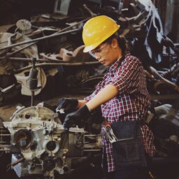 Woman working on engine