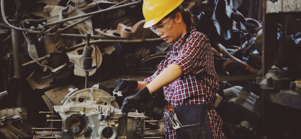 Woman working on engine