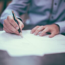 Man at desk with paperwork