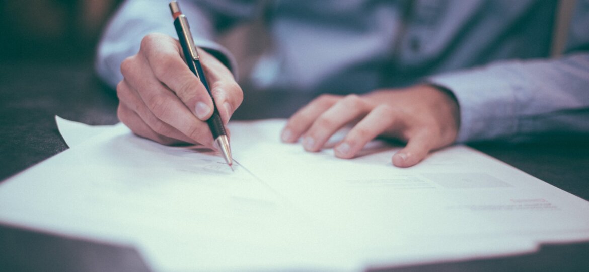 Man at desk with paperwork