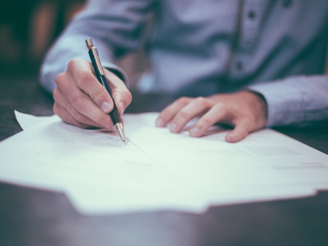 Man at desk with paperwork