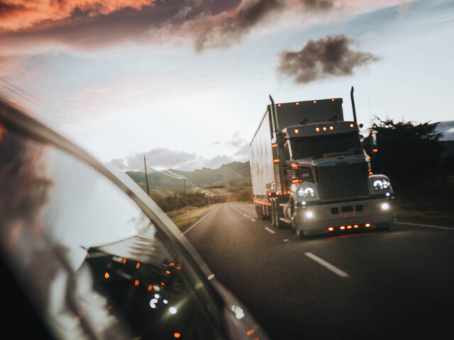 Semi in rear view mirror