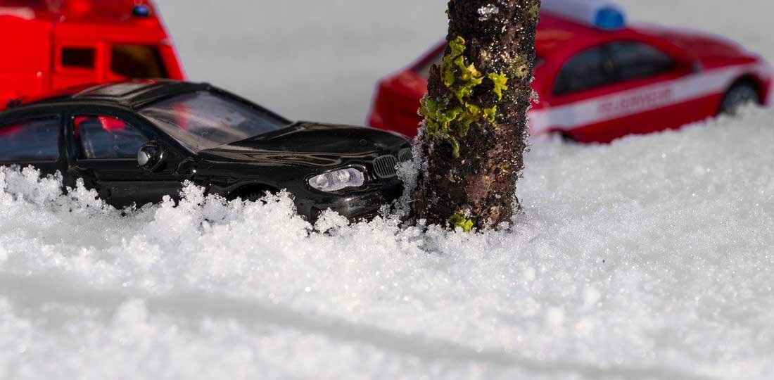 Black toy car in snow